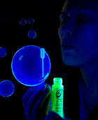 Blowing Tekno Bubbles® under Blacklight